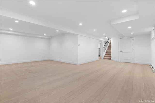 basement featuring light colored carpet