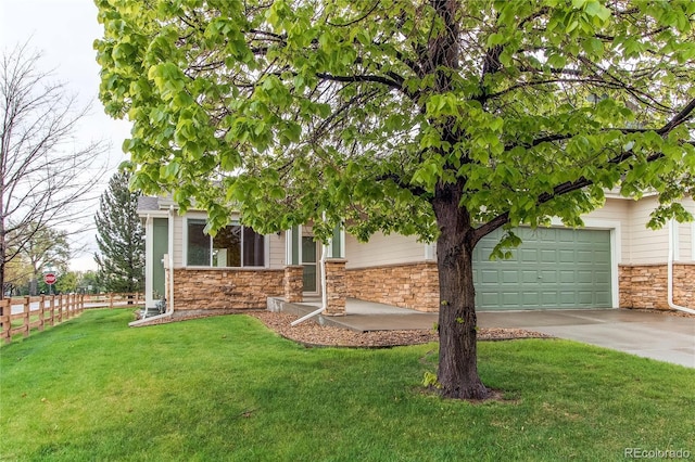 107 Carina Cir, Loveland, CO 80537 - view of property hidden behind natural elements featuring stone siding, driveway, and a garage