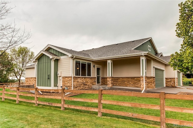107 Carina Cir, Loveland, CO 80537 - craftsman inspired home with board and batten siding, stone siding, roof with shingles, a garage, and concrete driveway