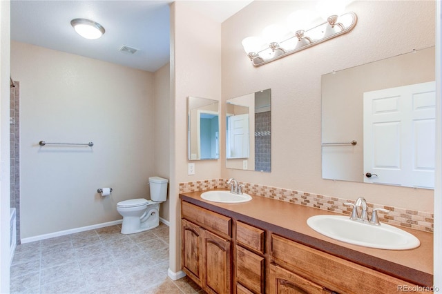 107 Carina Cir, Loveland, CO 80537 - full bathroom featuring toilet, baseboards, double vanity, tile patterned flooring, and a shower