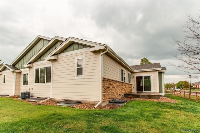107 Carina Cir, Loveland, CO 80537 - rear view of property featuring board and batten siding and stone siding