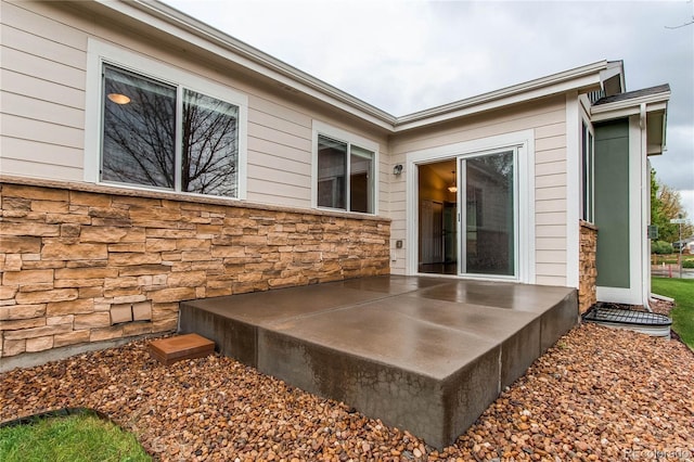 107 Carina Cir, Loveland, CO 80537 - view of home's exterior featuring stone siding