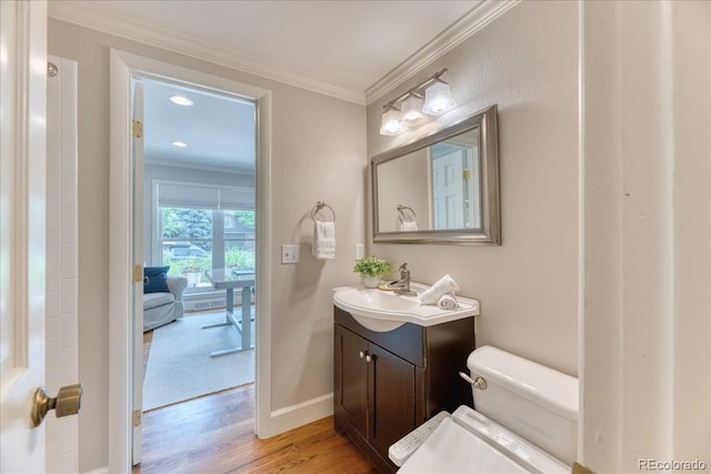 8167 S Wabash Ct, Centennial, CO 80112 - bathroom featuring wood finished floors, ornamental molding, and vanity