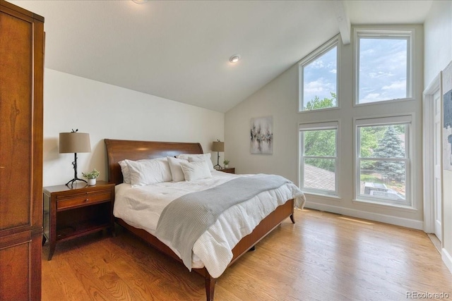 8167 S Wabash Ct, Centennial, CO 80112 - bedroom featuring light wood-type flooring and high vaulted ceiling