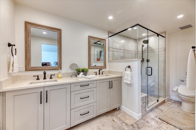 8167 S Wabash Ct, Centennial, CO 80112 - full bath featuring double vanity, a shower stall, and recessed lighting