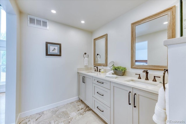 8167 S Wabash Ct, Centennial, CO 80112 - bathroom with double vanity and recessed lighting