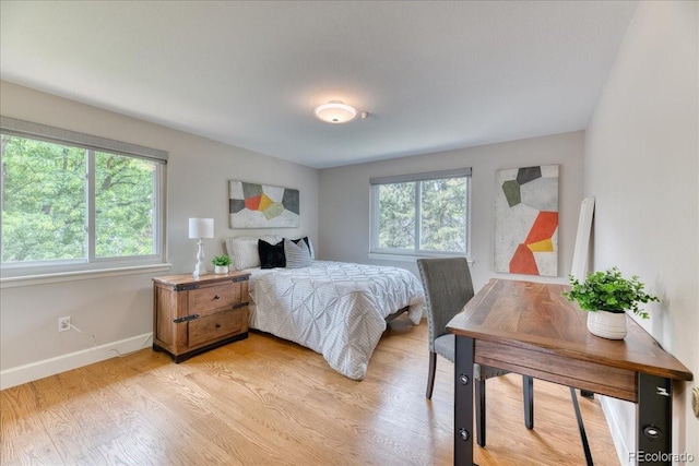 8167 S Wabash Ct, Centennial, CO 80112 - bedroom featuring multiple windows and light wood-type flooring