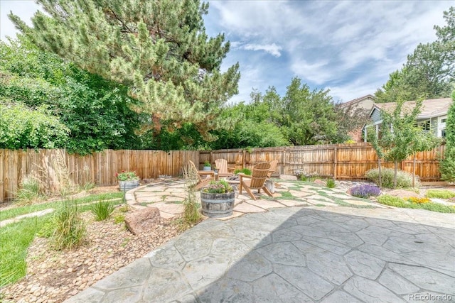 8167 S Wabash Ct, Centennial, CO 80112 - fenced backyard featuring a patio