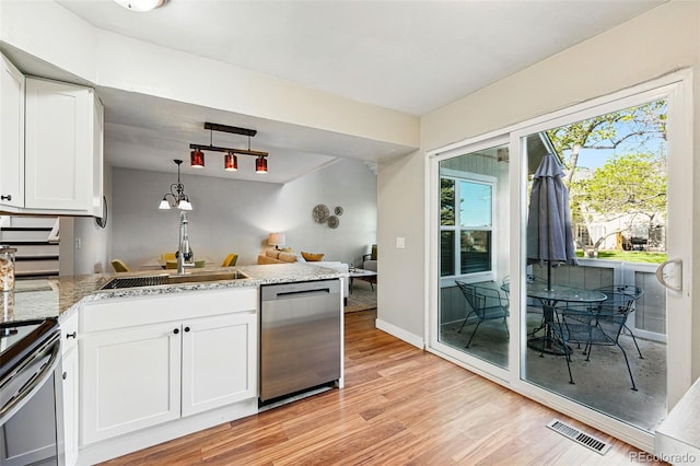 kitchen with stainless steel dishwasher, a sink, white cabinetry, light wood-style flooring, and electric range
