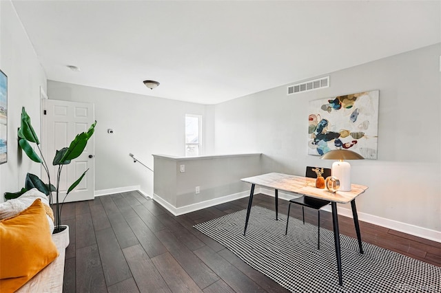 office featuring baseboards and dark wood-style flooring