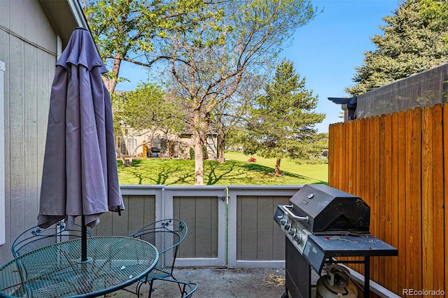 view of patio / terrace featuring area for grilling and outdoor dining area