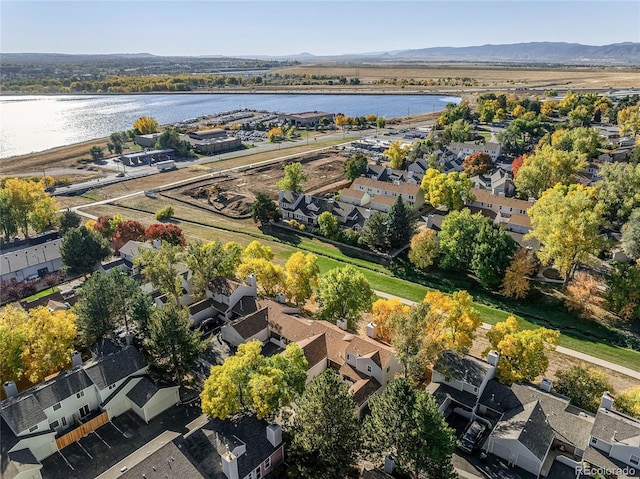 birds eye view of property featuring a water and mountain view