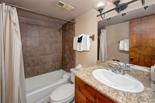 full bathroom featuring toilet, vanity, and shower / bathtub combination with curtain