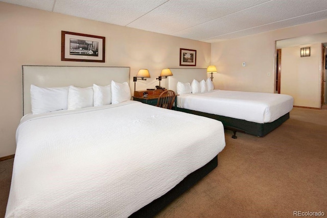 carpeted bedroom with a textured ceiling