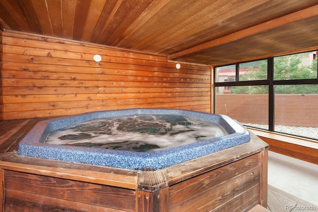 interior space featuring wood ceiling and wooden walls