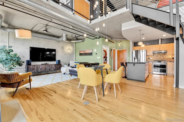 dining space featuring light wood-style flooring