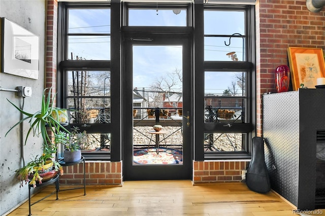 doorway featuring hardwood / wood-style floors and plenty of natural light