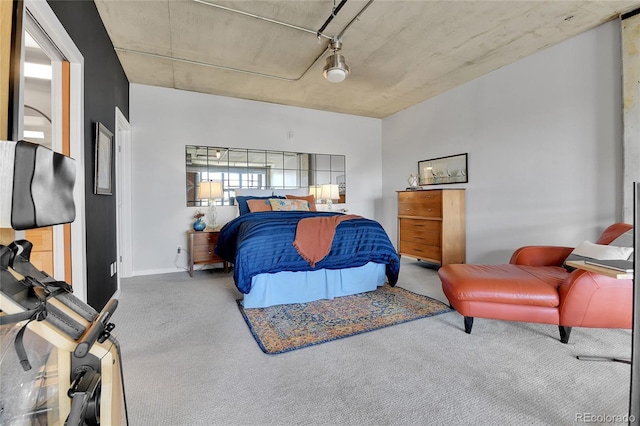 bedroom featuring a garage and carpet flooring