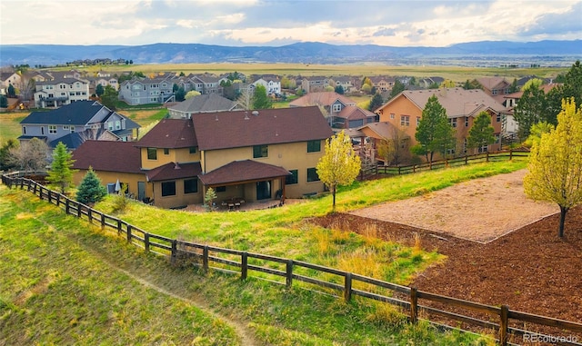 aerial view of residential area featuring mountains