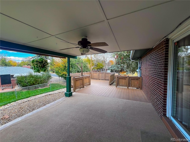 view of patio with a deck and ceiling fan