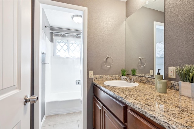 bathroom featuring vanity, bathing tub / shower combination, and tile patterned floors