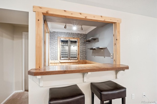 bar featuring carpet flooring and crown molding