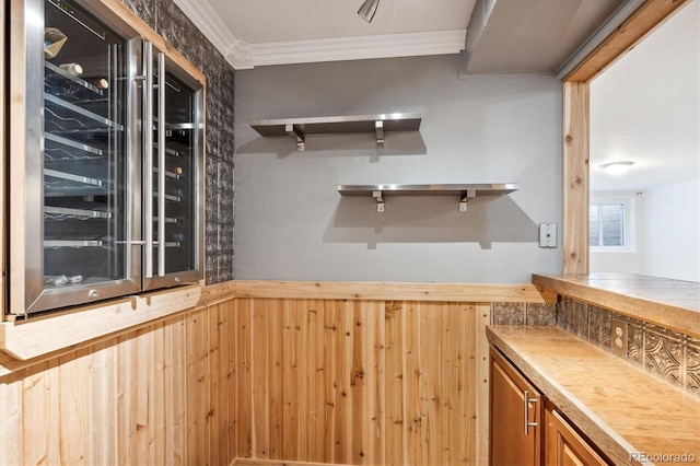 bar with wooden walls and ornamental molding