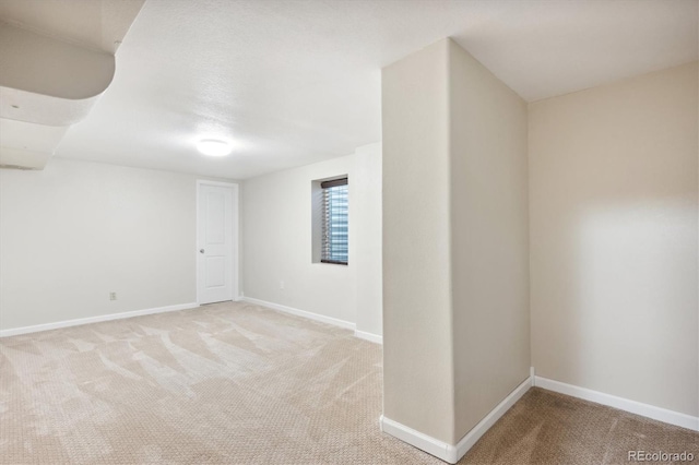 spare room with light carpet