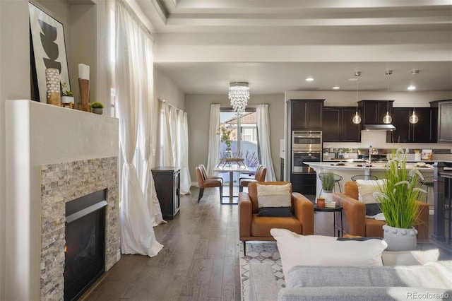 living room with hardwood / wood-style floors and a fireplace