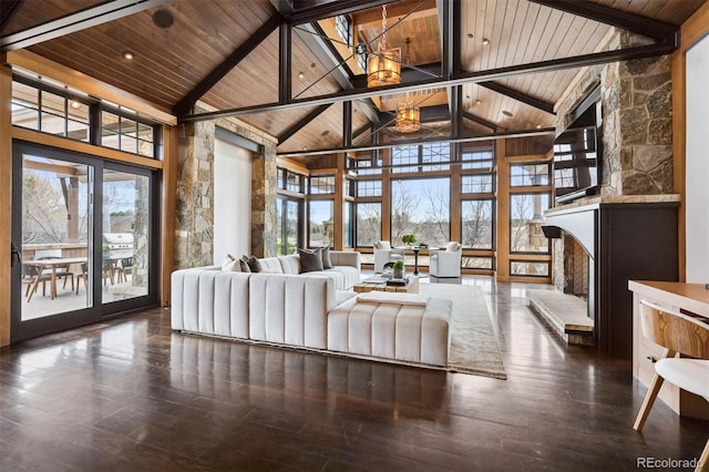 unfurnished living room with wooden ceiling, beam ceiling, and wood finished floors