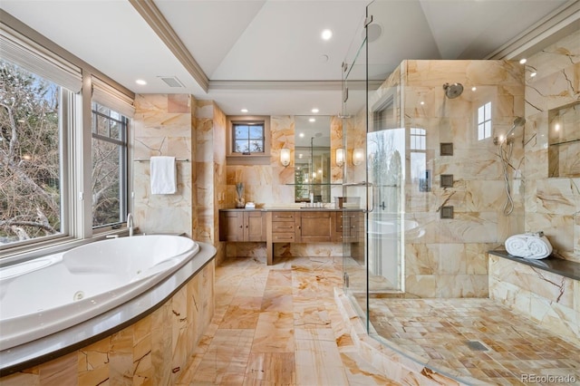 full bath featuring a stall shower, a healthy amount of sunlight, vanity, and a tub with jets