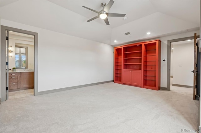 unfurnished bedroom featuring recessed lighting, light colored carpet, visible vents, vaulted ceiling, and baseboards