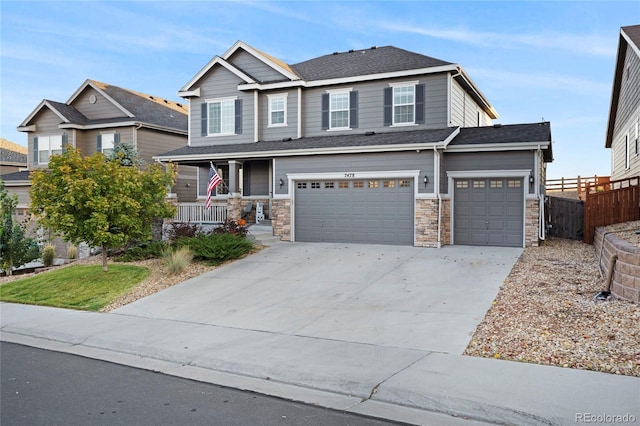 craftsman-style house featuring a porch and a garage