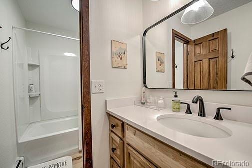 1143 Straight Creek Dr Unit H103, Dillon, CO 80435 - bathroom with vanity and bathing tub / shower combination