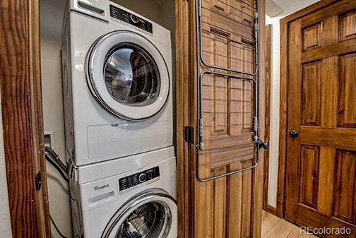 1143 Straight Creek Dr Unit H103, Dillon, CO 80435 - laundry area with stacked washer / drying machine and laundry area