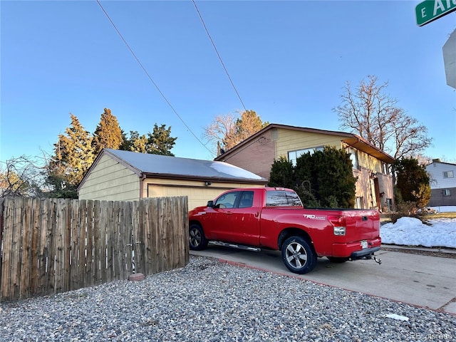 view of property exterior featuring a garage