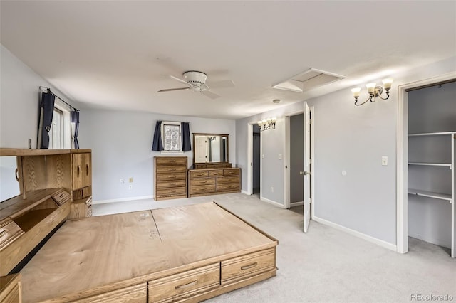 unfurnished bedroom with baseboards, a ceiling fan, and light colored carpet