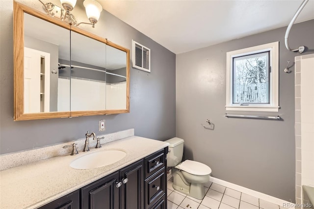 full bathroom featuring toilet, baseboards, visible vents, tile patterned floors, and vanity