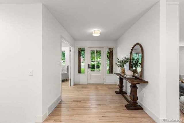 4 Doral Ln, Littleton, CO 80123 - foyer entrance featuring light wood-style flooring and baseboards