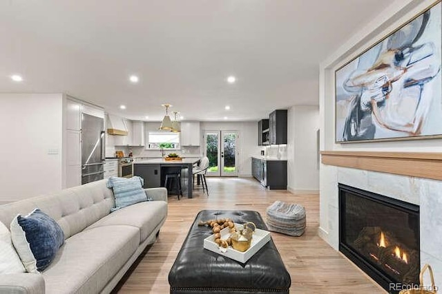 4 Doral Ln, Littleton, CO 80123 - living room with recessed lighting, a tile fireplace, and light wood finished floors