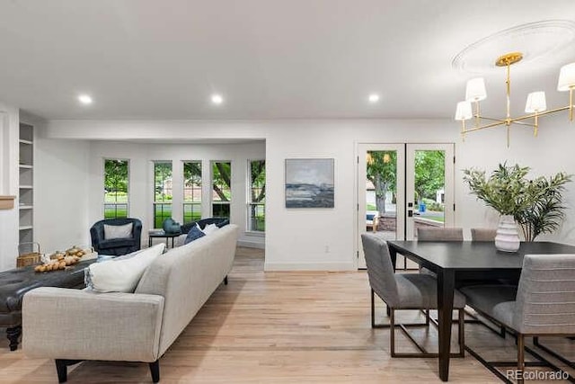 4 Doral Ln, Littleton, CO 80123 - living room featuring a chandelier, french doors, recessed lighting, and light wood finished floors
