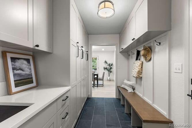 4 Doral Ln, Littleton, CO 80123 - mudroom featuring dark tile patterned flooring