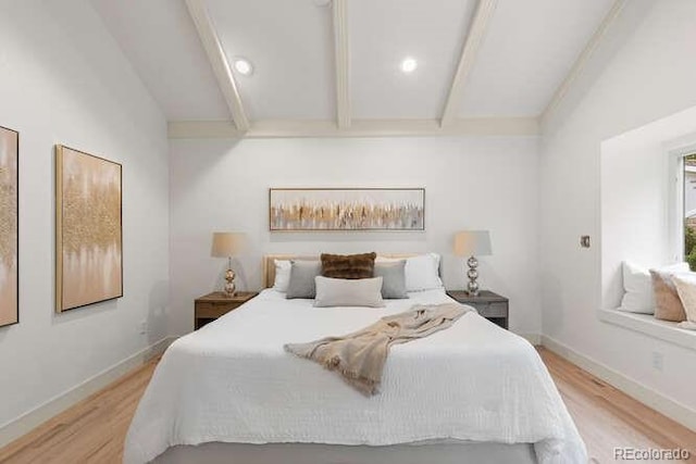 4 Doral Ln, Littleton, CO 80123 - bedroom with light wood-style flooring and beam ceiling