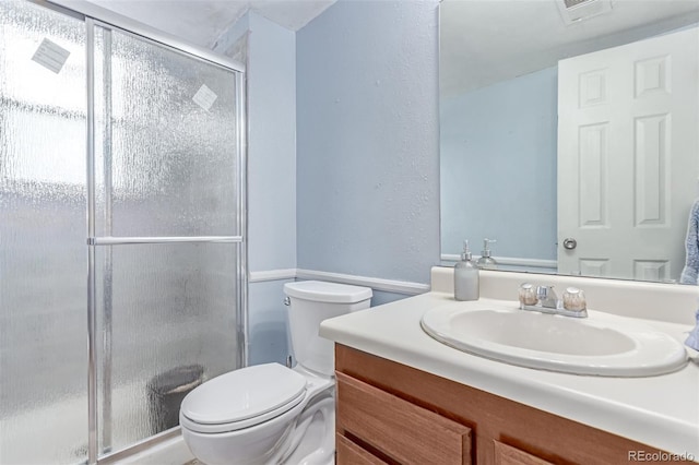 18206 E Loyola Dr, Aurora, CO 80013 - bathroom with vanity, a shower stall, and a textured wall