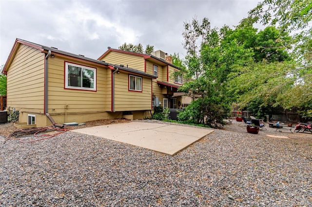 18206 E Loyola Dr, Aurora, CO 80013 - rear view of house featuring a chimney and a patio area