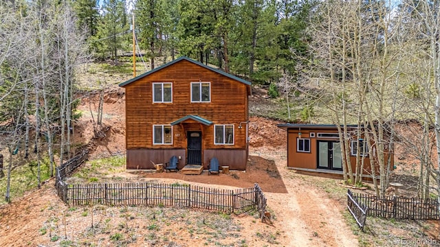 325 Willow Rd, Divide, CO 80814 - rustic home featuring french doors and an outdoor structure