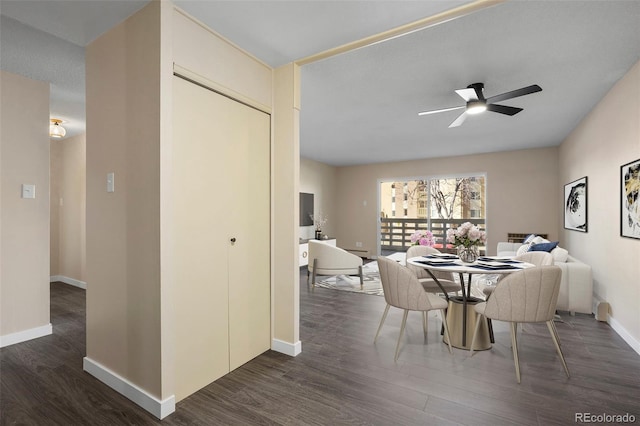 dining space with dark hardwood / wood-style floors and ceiling fan