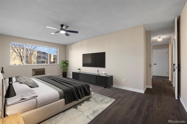 bedroom featuring ceiling fan, dark hardwood / wood-style floors, and a textured ceiling