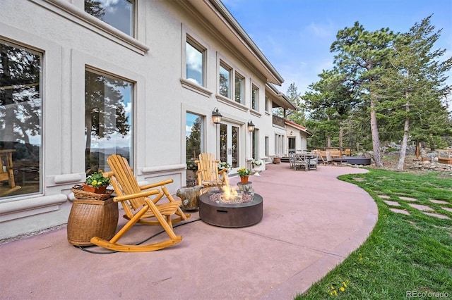 1425 Autumnwood Ln, Evergreen, CO 80439 - view of patio with an outdoor fire pit and french doors
