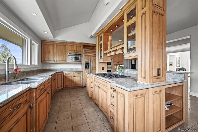 1425 Autumnwood Ln, Evergreen, CO 80439 - kitchen featuring a sink, paneled built in refrigerator, stainless steel gas stovetop, light tile patterned flooring, and light stone countertops
